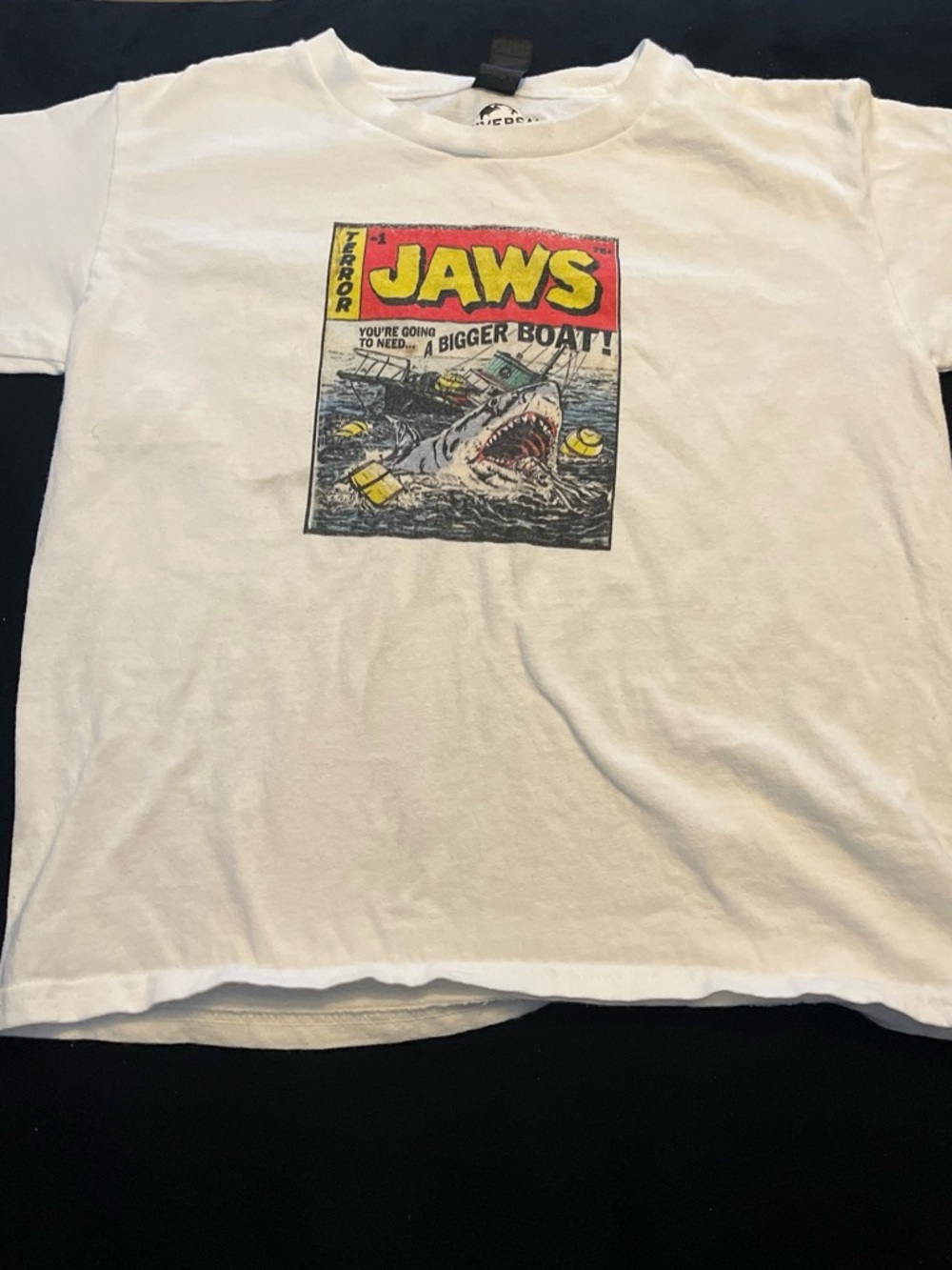 Universal White JAWS Comic-Style Graphic Tee with Red & Yellow Logo